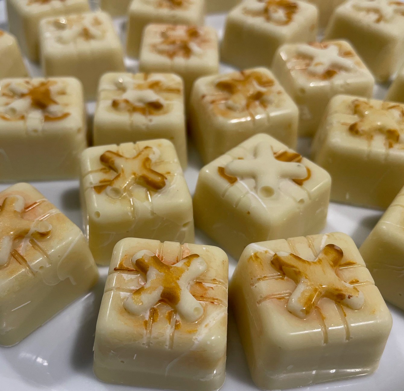 white chocolates with decorative accents