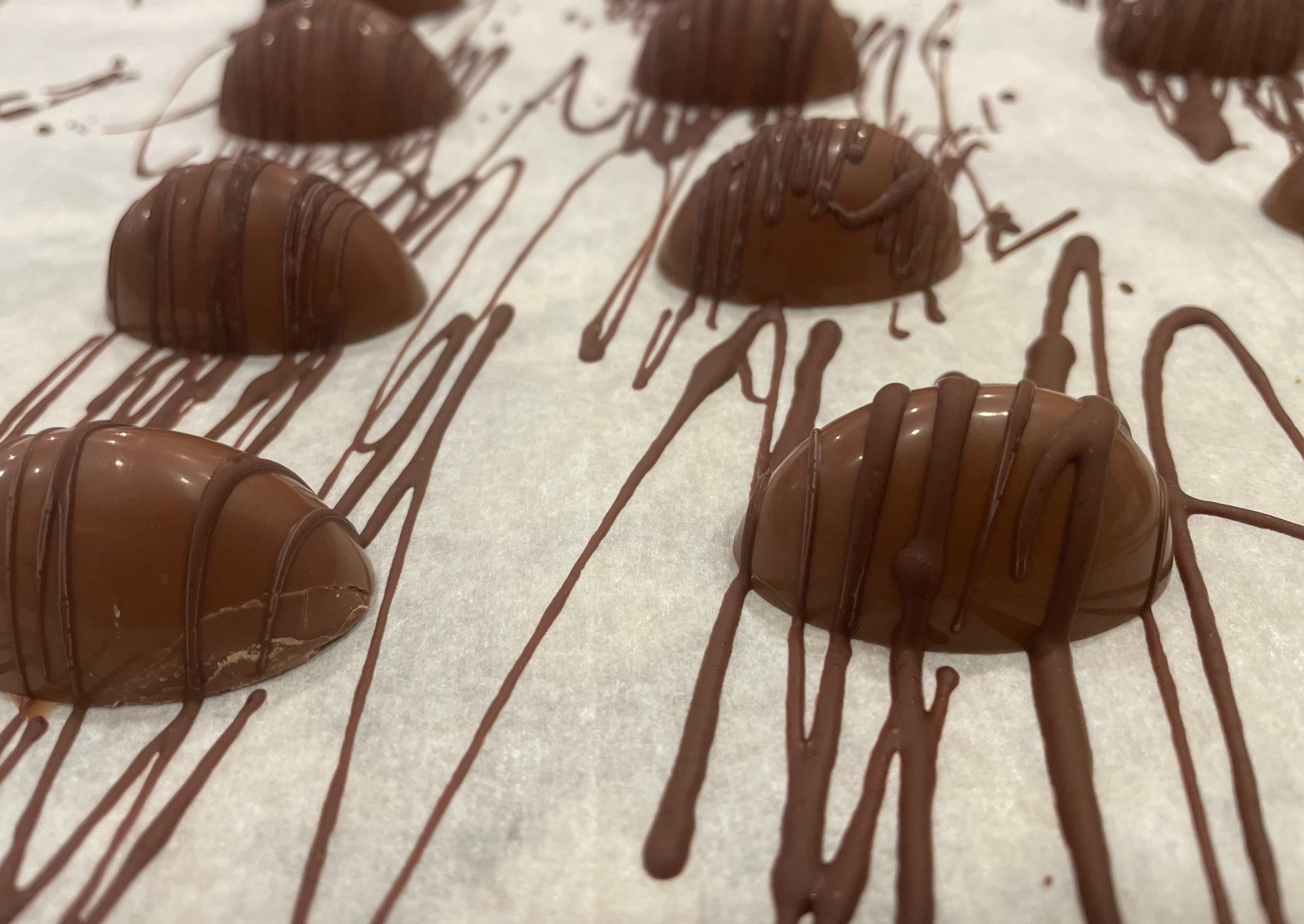 milk chocolate bonbons with drizzle